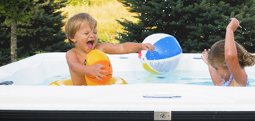 hot tub, kid, beach ball, smile